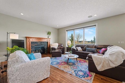 39 Elgin Estates Green Se, Calgary, AB - Indoor Photo Showing Living Room With Fireplace