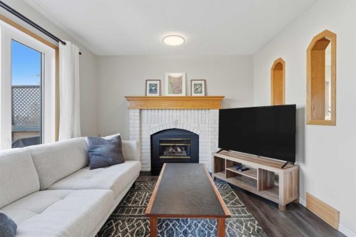 175 Macewan Park Circle Nw, Calgary, AB - Indoor Photo Showing Living Room With Fireplace
