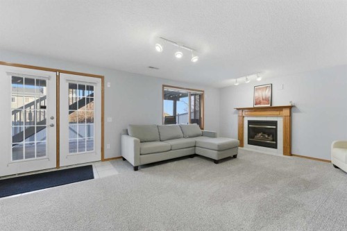 175 Macewan Park Circle Nw, Calgary, AB - Indoor Photo Showing Living Room With Fireplace
