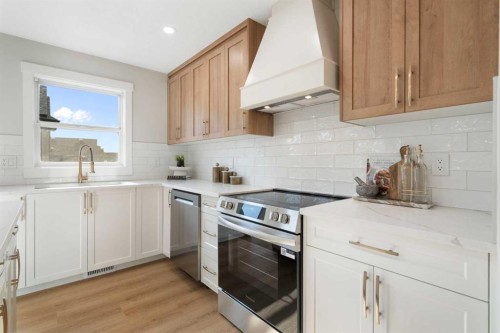 335 Hidden Creek Boulevard Nw, Calgary, AB - Indoor Photo Showing Kitchen With Upgraded Kitchen