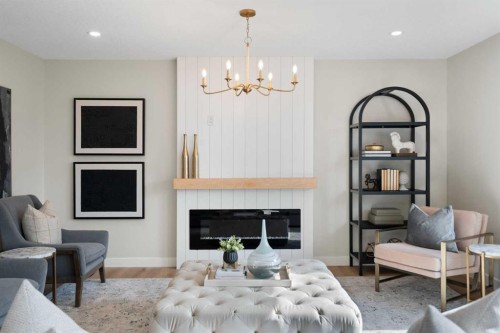 335 Hidden Creek Boulevard Nw, Calgary, AB - Indoor Photo Showing Other Room With Fireplace