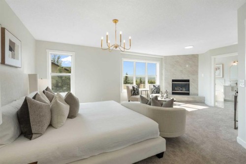 335 Hidden Creek Boulevard Nw, Calgary, AB - Indoor Photo Showing Bedroom With Fireplace