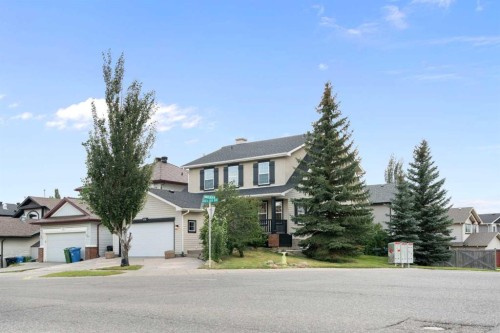 335 Hidden Creek Boulevard Nw, Calgary, AB - Outdoor With Facade