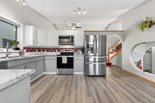 1336 Meadowbrook Drive Se, Airdrie, AB - Indoor Photo Showing Kitchen With Stainless Steel Kitchen With Double Sink