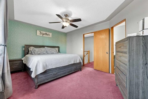 1336 Meadowbrook Drive Se, Airdrie, AB - Indoor Photo Showing Bedroom