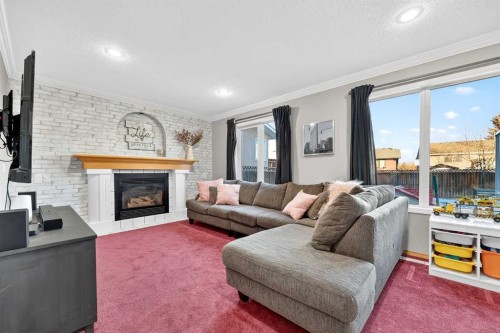 1336 Meadowbrook Drive Se, Airdrie, AB - Indoor Photo Showing Living Room With Fireplace