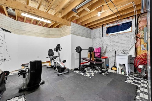 1336 Meadowbrook Drive Se, Airdrie, AB - Indoor Photo Showing Gym Room