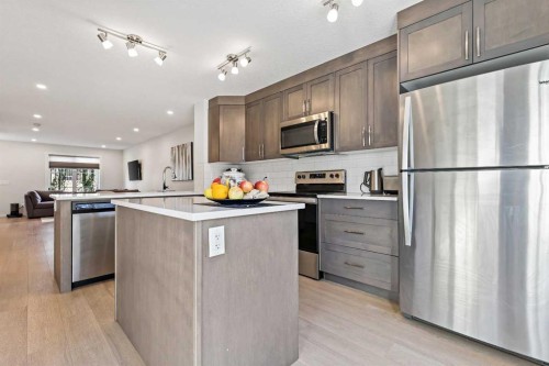 107-474 Seton Circle Se, Calgary, AB - Indoor Photo Showing Kitchen With Stainless Steel Kitchen With Upgraded Kitchen