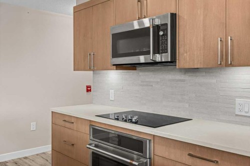 111-810 7Th Street, Canmore, AB - Indoor Photo Showing Kitchen With Upgraded Kitchen