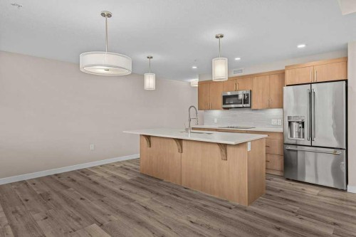 111-810 7Th Street, Canmore, AB - Indoor Photo Showing Kitchen With Upgraded Kitchen