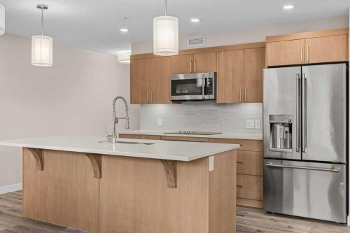 111-810 7Th Street, Canmore, AB - Indoor Photo Showing Kitchen With Upgraded Kitchen