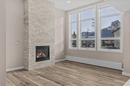 111-810 7Th Street, Canmore, AB - Indoor Photo Showing Living Room With Fireplace