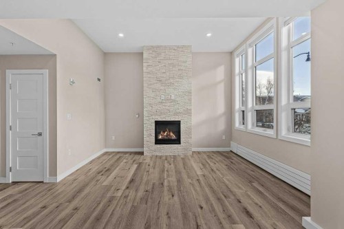 111-810 7Th Street, Canmore, AB - Indoor With Fireplace