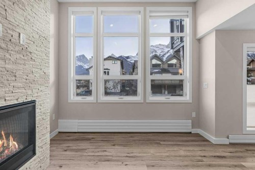 111-810 7Th Street, Canmore, AB - Indoor With Fireplace