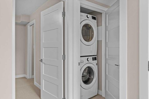 111-810 7Th Street, Canmore, AB - Indoor Photo Showing Laundry Room