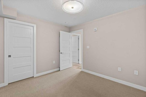 111-810 7Th Street, Canmore, AB - Indoor Photo Showing Other Room