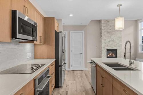 111-810 7Th Street, Canmore, AB - Indoor Photo Showing Kitchen With Double Sink With Upgraded Kitchen