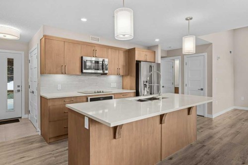 111-810 7Th Street, Canmore, AB - Indoor Photo Showing Kitchen With Double Sink With Upgraded Kitchen