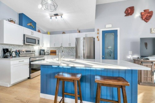 138 Westview Drive, Nanton, AB - Indoor Photo Showing Kitchen With Stainless Steel Kitchen With Double Sink