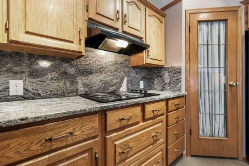 1208 Sunvista Way Se, Calgary, AB - Indoor Photo Showing Kitchen