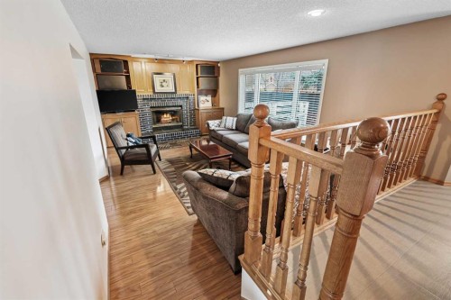 1208 Sunvista Way Se, Calgary, AB - Indoor With Fireplace