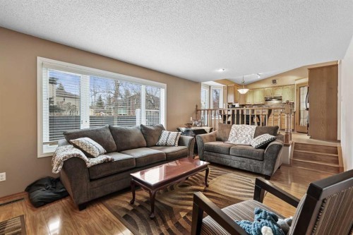 1208 Sunvista Way Se, Calgary, AB - Indoor Photo Showing Living Room