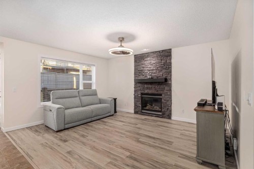 38 Evansbrooke Manor Nw, Calgary, AB - Indoor Photo Showing Living Room With Fireplace