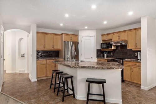 38 Evansbrooke Manor Nw, Calgary, AB - Indoor Photo Showing Kitchen With Double Sink With Upgraded Kitchen