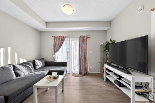 101-20 Seton Park Se, Calgary, AB - Indoor Photo Showing Living Room