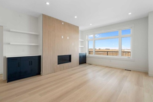 150 Muirfield Boulevard, Lyalta, AB - Indoor Photo Showing Other Room With Fireplace