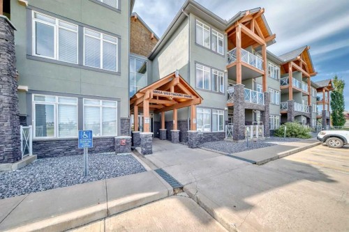 102-1005A Westmount Drive, Strathmore, AB - Outdoor With Balcony With Facade