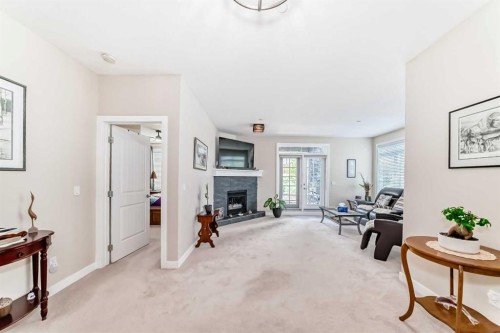 102-1005A Westmount Drive, Strathmore, AB - Indoor With Fireplace