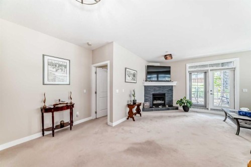102-1005A Westmount Drive, Strathmore, AB - Indoor With Fireplace