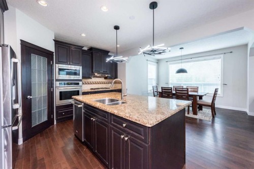 35 Aspen Stone Way Sw, Calgary, AB - Indoor Photo Showing Kitchen With Stainless Steel Kitchen With Double Sink With Upgraded Kitchen