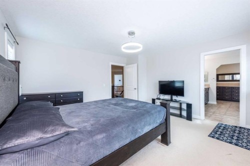 35 Aspen Stone Way Sw, Calgary, AB - Indoor Photo Showing Bedroom