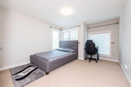 35 Aspen Stone Way Sw, Calgary, AB - Indoor Photo Showing Bedroom
