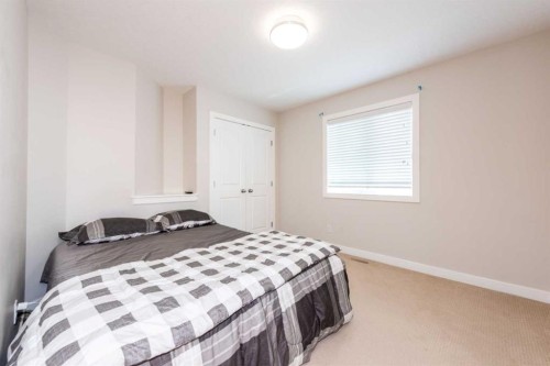 35 Aspen Stone Way Sw, Calgary, AB - Indoor Photo Showing Bedroom