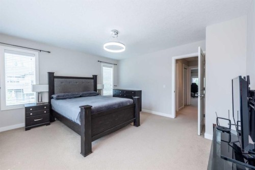 35 Aspen Stone Way Sw, Calgary, AB - Indoor Photo Showing Bedroom
