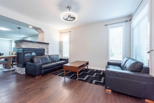 35 Aspen Stone Way Sw, Calgary, AB - Indoor Photo Showing Living Room With Fireplace