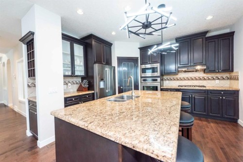 35 Aspen Stone Way Sw, Calgary, AB - Indoor Photo Showing Kitchen With Stainless Steel Kitchen With Double Sink With Upgraded Kitchen