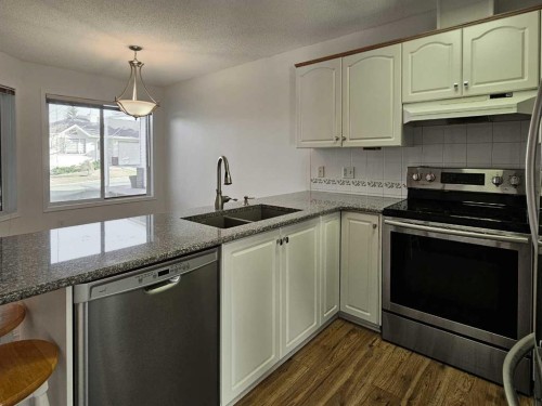 112 Harvest Oak Circle Ne, Calgary, AB - Indoor Photo Showing Kitchen With Double Sink