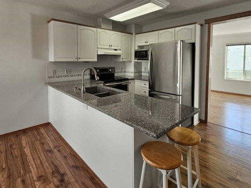 112 Harvest Oak Circle Ne, Calgary, AB - Indoor Photo Showing Kitchen With Double Sink
