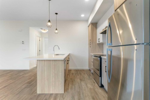 1803-24 Rivercrest Drive, Cochrane, AB - Indoor Photo Showing Kitchen With Upgraded Kitchen