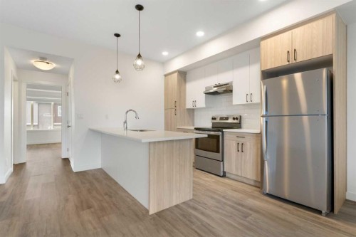1803-24 Rivercrest Drive, Cochrane, AB - Indoor Photo Showing Kitchen With Upgraded Kitchen