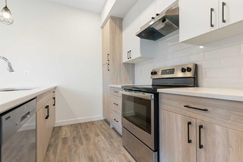 1803-24 Rivercrest Drive, Cochrane, AB - Indoor Photo Showing Kitchen With Upgraded Kitchen