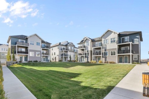 1803-24 Rivercrest Drive, Cochrane, AB - Outdoor With Facade