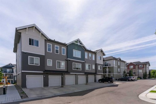 1803-24 Rivercrest Drive, Cochrane, AB - Outdoor With Facade