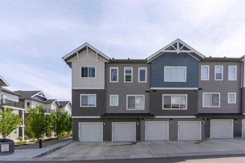 1803-24 Rivercrest Drive, Cochrane, AB - Outdoor With Facade