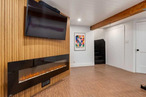 2539 Chicoutimi Drive Nw, Calgary, AB - Indoor Photo Showing Other Room With Fireplace