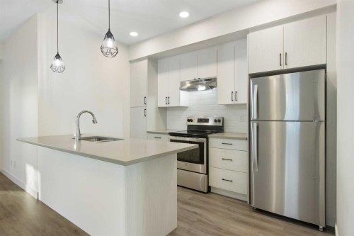 1301-24 Rivercrest Drive, Cochrane, AB - Indoor Photo Showing Kitchen With Upgraded Kitchen